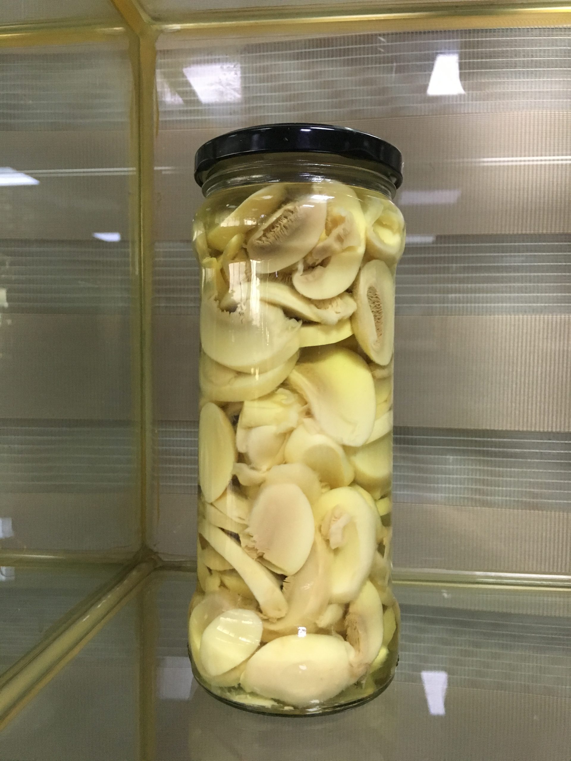 Mushroom pieces and stems in brine